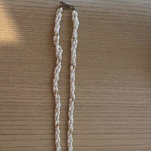 28 inch Rice Pearl  necklace, with silver screw clasp.